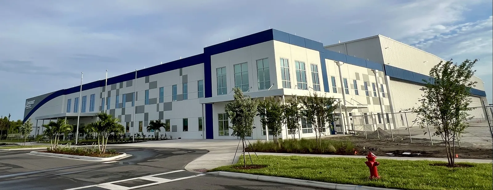 Completed exterior of a large aviation and office facility glazed by Boring's Glass Co.